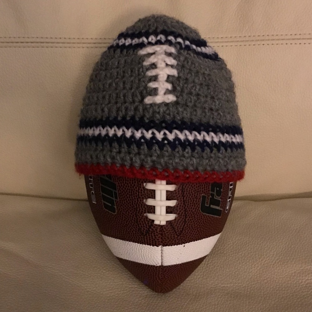 Homemade small child’s football knitted hat